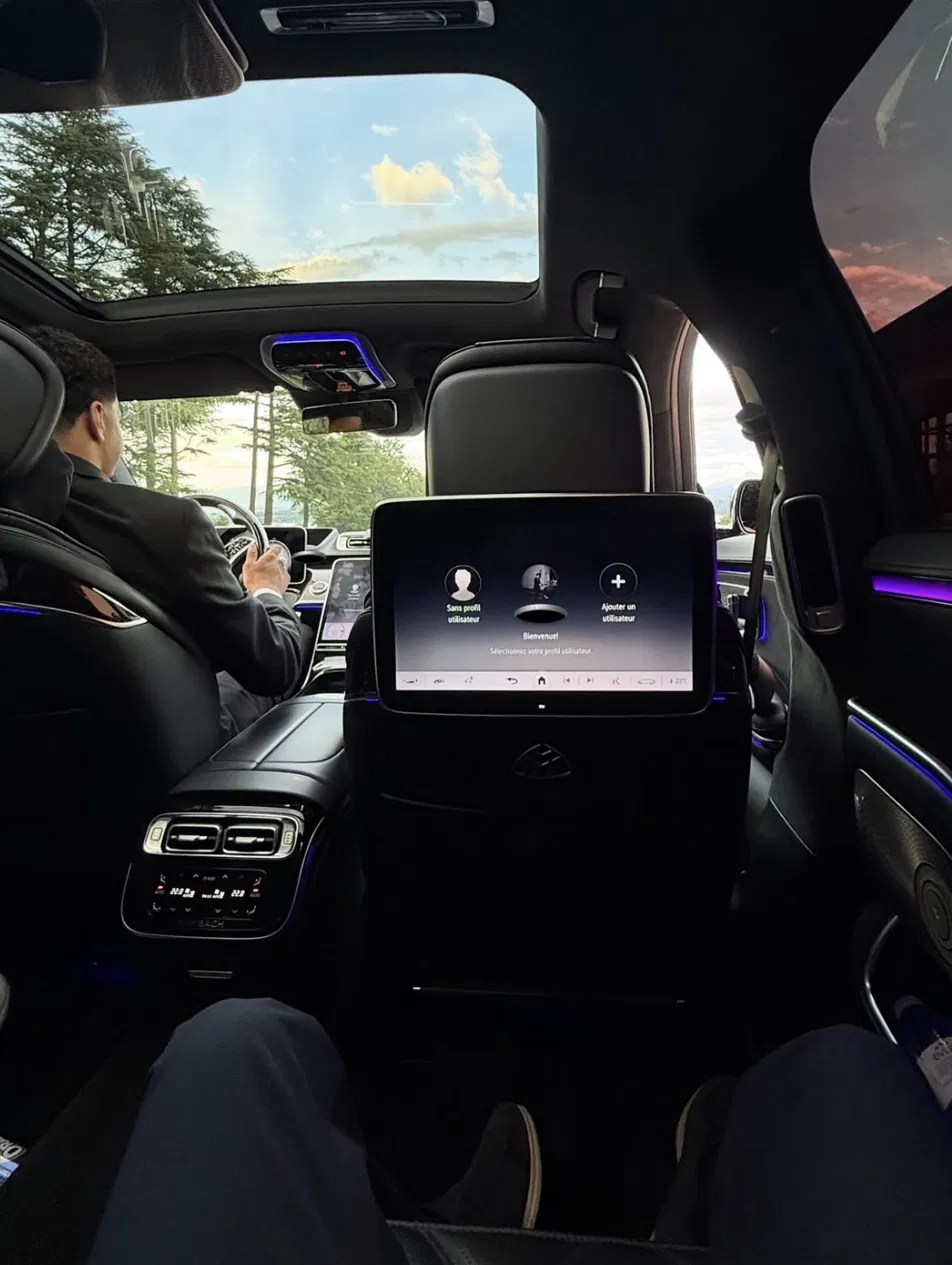 Private chauffeur from Geneva to Crans-Montana, rear seat of a Mercedes-Maybach on the road